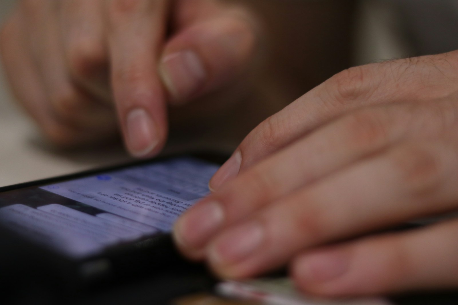 a close up of a person using a cell phone